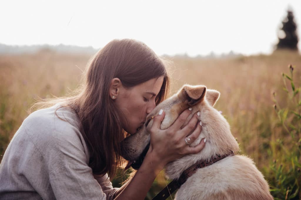 Woman kissed her dog