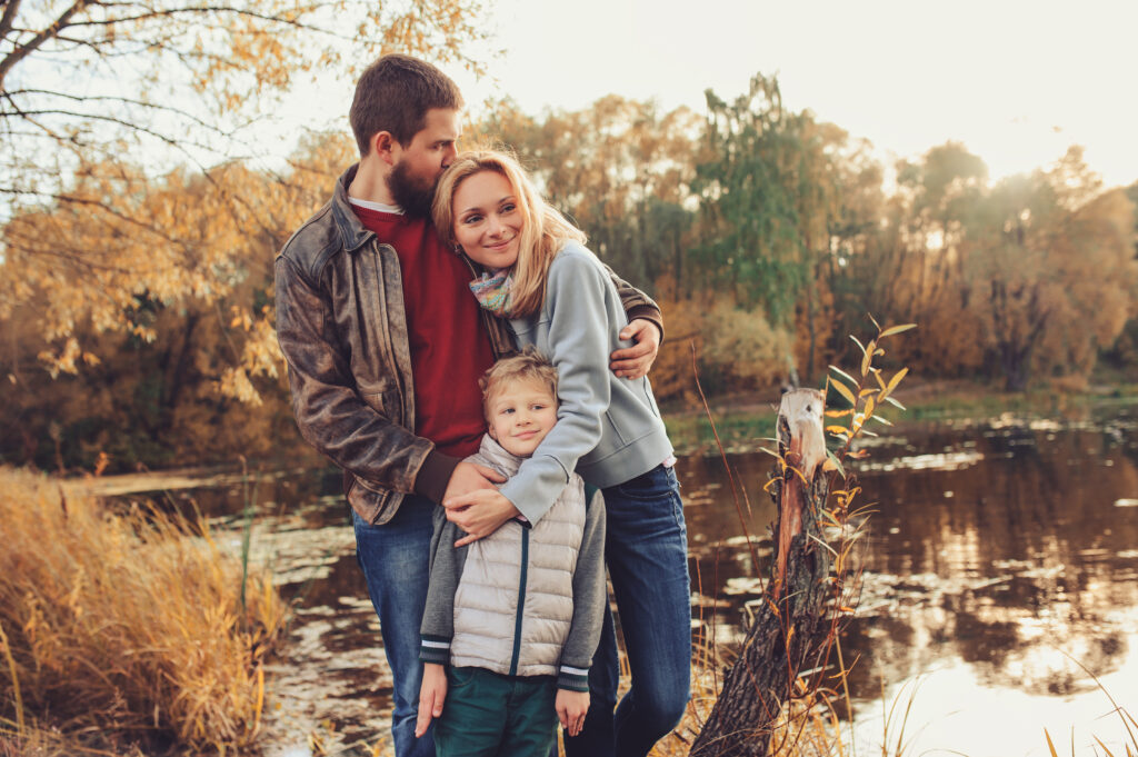Image of a family of 3 standing together in front of a lake. A family therapist can help ease the transition as your child is becoming a teenager. It is not always easy to reach out for help but Onyx can help in family therapy. Don't struggle alone, reach out for more information on family counselling in Edmonton. Call today!