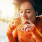 Woman eating burger